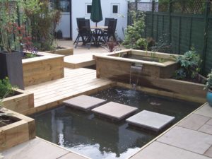 Fully Landscaped Rear Garden with Prominent Water Feature